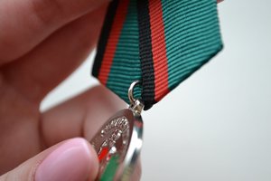 Медаль и документ 25 років виведення радянських військ з Афг