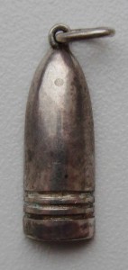 Жетон в виде снаряда.