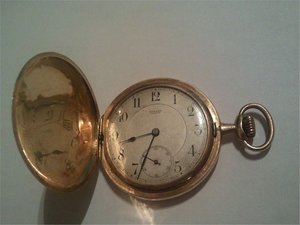 Золотые часы  MOVADO surete
