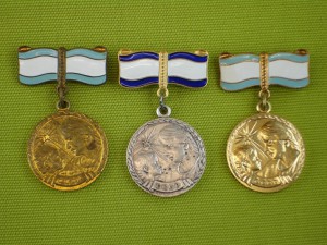 Три медали материнства.
