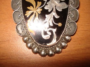 Серебряная брошь с кубы стоимость