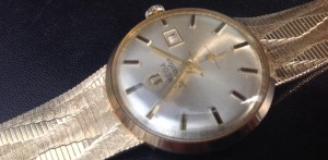 Omega золото