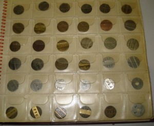 Коллекция жетонов в альбоме