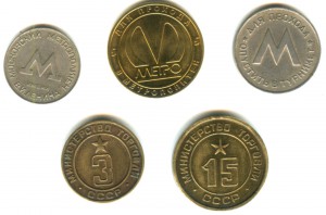 Коллекция жетонов в альбоме