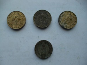 Четыре советских жетона.