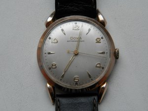 Швейцарские золотые часы DOXA