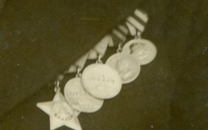 Фото с наградами и кортиком.