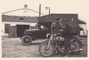 Грузовик и мотоцикл. Возле гаража. 1940-е годы.