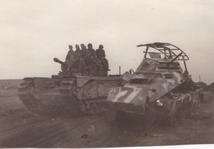 Советские танкисты на английском танке. Подбитый броневик.