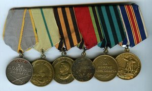 Медали и документы на царско-советскую сестру милосердия