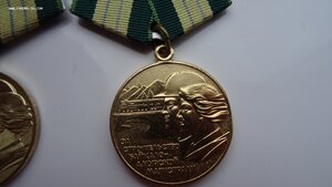 Две медали БАМ с удостоверением на мужа и жену.