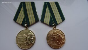 Две медали БАМ с удостоверением на мужа и жену.