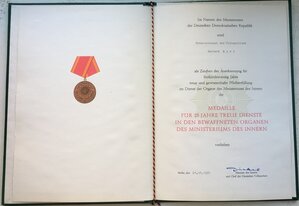 Две медали МВД ГДР с грамотами на лейтенанта полиции