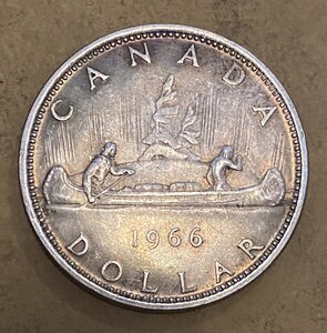 Канада. Один доллар 1966. Индейцы в лодке каноэ. Серебро.