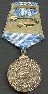 Две медали Нахимова, номера подряд!