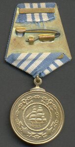 Две медали Нахимова, номера подряд!
