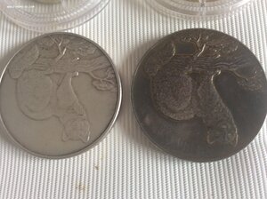 16 серебряных монет РФ.