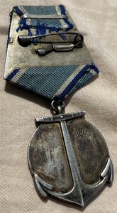 Мeдаль УшaкoвА  на врeм. yд-нии