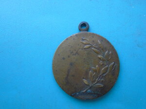 Жетон с изображением женщины на лошади.