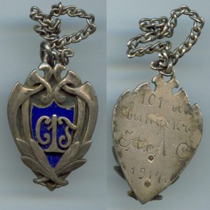 Знак гимназии в серебре.