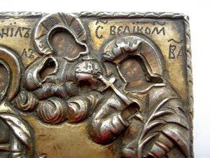 Икона в кованом серебряном окладе.